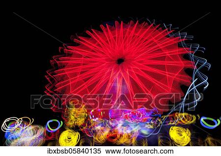 Stock Photography - Night shot, dynamic lights, rides, Giegelberg amusement park, Biberach, Baden-Württemberg, Germany, Europe. Fotosearch