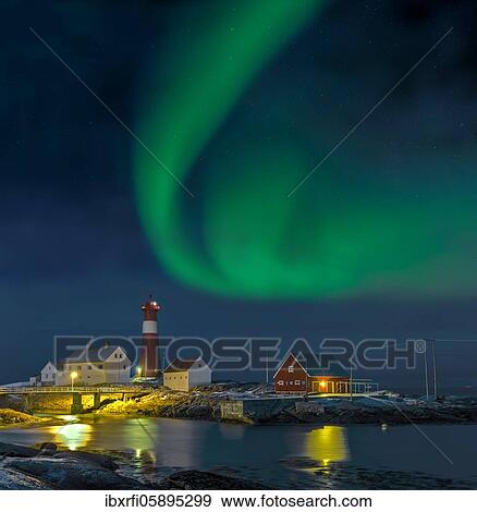 Stock Photo - Northern lights Hamaroy lighthouse in Norway. Fotosearch