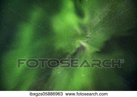 Stock Image - Northern lights in front of a starry sky, Leknes, Nordland, Lofoten, Norway, Europe. Fotosearch