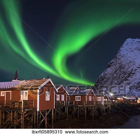 Stock Image - Northern Lights in Pure Historic Fishing Lofoten Norway. Fotosearch