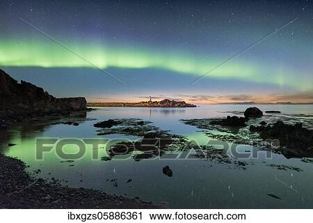 Northern lights over the sea, island with small lighthouse, Vågan, Lofoten, Nordland, Norway, Europe View Large Photo Image Stock Image - Northern lights over the sea, island with small lighthouse, Vågan, Lofoten, Nordland, Norway, Europe. Fotosearch