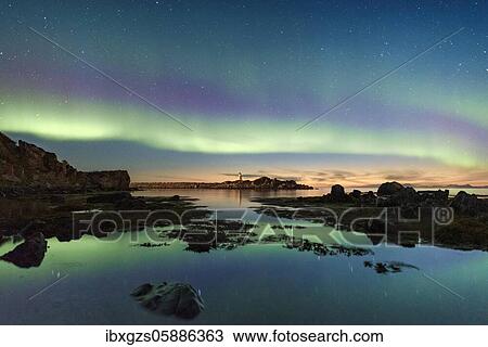 Northern lights over the sea, island with small lighthouse, Gimsøy, Lofoten, Nordland, Norway, Europe View Large Photo Image Stock Image - Northern lights over the sea, island with small lighthouse, Gimsøy, Lofoten, Nordland, Norway, Europe. Fotosearch