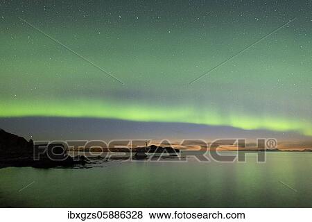Northern lights over the sea, island with small lighthouse, Vågan, Lofoten, Nordland, Norway, Europe View Large Photo Image Stock Photo - Northern lights over the sea, island with small lighthouse, Vågan, Lofoten, Nordland, Norway, Europe. Fotosearch