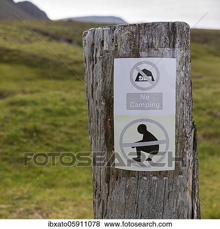 Note with pictograms and inscription No camping at a pole, Wild camping prohibited, Vestfirðir, Westfjords, Iceland, Europe View Large Photo Image Stock Photo - Note with pictograms and inscription No camping at a pole, Wild camping prohibited, Vestfirðir, Westfjords, Iceland, Europe. Fotosearch