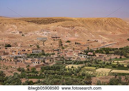 Stock Image - Oasis Tinerhir with old mud houses and newly constructed buildings, Tinerhir, Souss-Massa-Draa, High Atlas, Morocco, Africa. Fotosearch