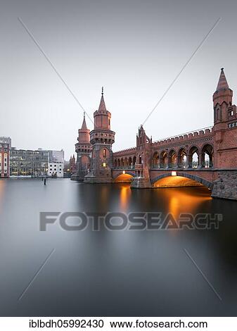 Oberbaum bridge across the Spree, connecting the Berlin districts of Kreuzberg and Friedrichshain, Berlin, Germany, Europe View Large Photo Image Stock Image - Oberbaum bridge across the Spree, connecting the Berlin districts of Kreuzberg and Friedrichshain, Berlin, Germany, Europe. Fotosearch