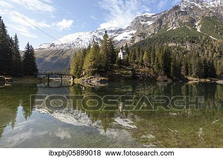 Obernberger See with chapel and bridge, Obernberger See, Tyrol, Austria, Europe View Large Photo Image Stock Photo - Obernberger See with chapel and bridge, Obernberger See, Tyrol, Austria, Europe. Fotosearch