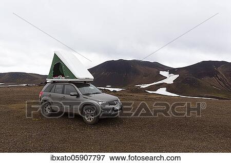 Off-road vehicle with roof tent on barren plateau, volcanic landscape with snowfields, Snæfellsjökull, Snäfellsjökull, Snæfellsnes peninsula, Snäfellsnes, Iceland, Europe View Large Photo Image Stock Photo - Off-road vehicle with roof tent on barren plateau, volcanic landscape with snowfields, Snæfellsjökull, Snäfellsjökull, Snæfellsnes peninsula, Snäfellsnes, Iceland, Europe. Fotosearch