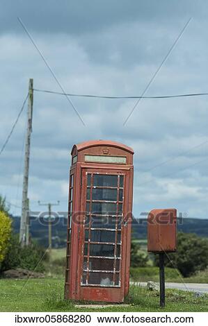 Stock Image - Old red English phone box, Cornwall, United Kingdom, Europe. Fotosearch