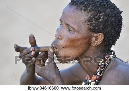 Old San woman smoking, portrait, Bushman tribe, Kalahari, Namibia, Africa View Large Photo Image Stock Image - Old San woman smoking, portrait, Bushman tribe, Kalahari, Namibia, Africa. Fotosearch