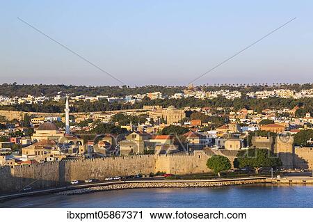 Stock Image - Old town of Rhodes with fortification walls at sunrise, Rhodes, Greece, Europe. Fotosearch