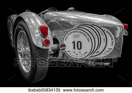 Stock Photography - Oldtimer detail, Alvis Special, in black and white, with red brake light. Fotosearch