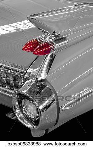 Oldtimer detail, Cadillac Sedan Deville 1959, in black and white, with red brake light View Large Photo Image Stock Photo - Oldtimer detail, Cadillac Sedan Deville 1959, in black and white, with red brake light. Fotosearch