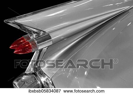 Stock Photo - Oldtimer detail, Cadillac Sedan Deville 1959, in black and white, with red brake light. Fotosearch