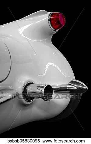 Stock Photography - Oldtimer detail, Chevrolet Corvette C1 1955, in black and white, with red brake light. Fotosearch