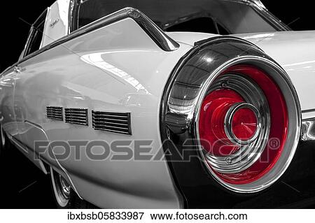 Oldtimer detail, Ford Thunderbird 1961, in black and white, with red brake light View Large Photo Image Stock Photo - Oldtimer detail, Ford Thunderbird 1961, in black and white, with red brake light. Fotosearch