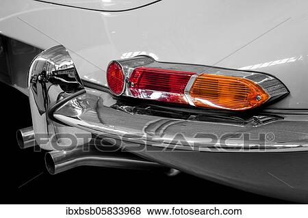 Oldtimer detail, Jaguar E Series 1, in black and white, with red brake light View Large Photo Image Stock Photo - Oldtimer detail, Jaguar E Series 1, in black and white, with red brake light. Fotosearch