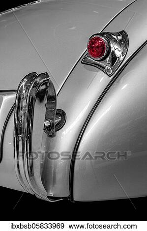 Oldtimer detail, Jaguar XK 120, in black and white, with red brake light View Large Photo Image Stock Photo - Oldtimer detail, Jaguar XK 120, in black and white, with red brake light. Fotosearch