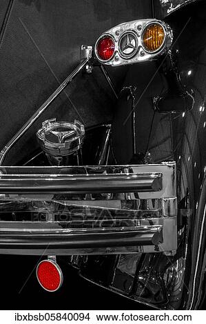 Oldtimer detail, Mercedes 770K Cabriolet D, in black and white, with red brake light View Large Photo Image Picture - Oldtimer detail, Mercedes 770K Cabriolet D, in black and white, with red brake light. Fotosearch