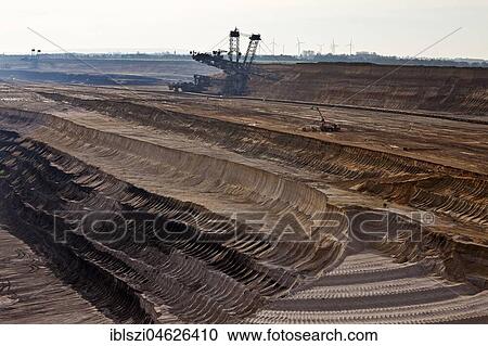 Open cast lignite mine with bucket wheel excavator, Garzweiler, Jüchen, Rheinisches Braunkohlerevier, North Rhine-Westphalia, Germany, Europe View Large Photo Image Stock Image - Open cast lignite mine with bucket wheel excavator, Garzweiler, Jüchen, Rheinisches Braunkohlerevier, North Rhine-Westphalia, Germany, Europe. Fotosearch