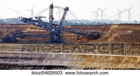Open cast lignite mine with bucket wheel excavator, Garzweiler, Jüchen, Rheinisches Braunkohlerevier, North Rhine-Westphalia, Germany, Europe View Large Photo Image Stock Image - Open cast lignite mine with bucket wheel excavator, Garzweiler, Jüchen, Rheinisches Braunkohlerevier, North Rhine-Westphalia, Germany, Europe. Fotosearch