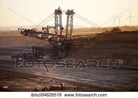 Open cast lignite mine with bucket wheel excavator, Garzweiler, Jüchen, Rheinisches Braunkohlerevier, North Rhine-Westphalia, Germany, Europe View Large Photo Image Stock Photograph - Open cast lignite mine with bucket wheel excavator, Garzweiler, Jüchen, Rheinisches Braunkohlerevier, North Rhine-Westphalia, Germany, Europe. Fotosearch
