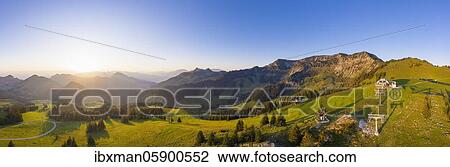 Stock Image - Panorama, sunrise at Sudelfeld, on the right big and small Traithen, near Bayrischzell, Mangfall mountains, drone picture, Upper Bavaria, Bavaria, Germany, Europe. Fotosearch