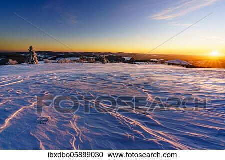 Stock Image - Panoramic view from Wasserkuppe in south direction in winter, sunset, nature park Park Hessian Rhön, Hesse, Germany, Europe. Fotosearch