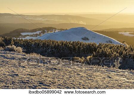 Stock Image - Panoramic view from Wasserkuppe in west direction in winter, nature park Park Hessian Rhön, Hesse, Germany, Europe. Fotosearch