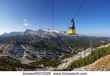 Panoramic view to the mountain station Gjaid and to the Hohen Dachstein, Dachstein massif, Krippenstein cable car, Obertraun, Salzkammergut, Upper Austria, Austria, Europe View Large Photo Image Stock Photograph - Panoramic view to the mountain station Gjaid and to the Hohen Dachstein, Dachstein massif, Krippenstein cable car, Obertraun, Salzkammergut, Upper Austria, Austria, Europe. Fotosearch