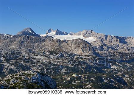 Stock Photograph - Panoramic view to the mountain station Gjaid and to the Hohen Dachstein, Dachstein massif, Krippenstein cable car, Obertraun, Salzkammergut, Upper Austria, Austria, Europe. Fotosearch