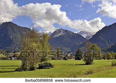 Stock Photo - Panoramic view to the mountains near Oberstdorf, Riefenkopf 1748m and Kegelkopf 1959m, Allgäu Alps, Allgäu, Bavaria, Germany, Europe. Fotosearch