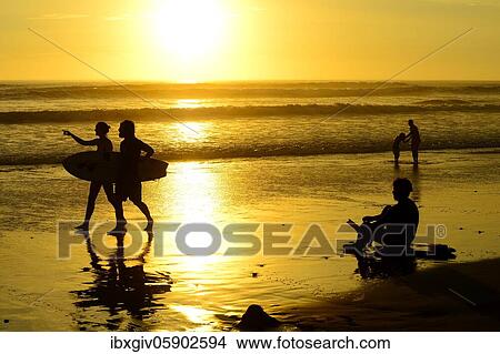 People on the beach with surfboard at sunset, Huanchaco, La Libertad region, Peru, South America View Large Photo Image Picture - People on the beach with surfboard at sunset, Huanchaco, La Libertad region, Peru, South America. Fotosearch