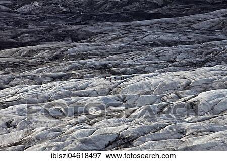 People on the glacier tongue of Svinafellsjökull in Vatnajökull National Park, Hornarfjördur, East Iceland, East Iceland View Large Photo Image Stock Photo - People on the glacier tongue of Svinafellsjökull in Vatnajökull National Park, Hornarfjördur, East Iceland, East Iceland. Fotosearch
