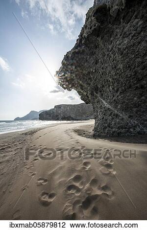 Stock Image - Petrified lava tongues and rocky coast at the beach Playa del Monsul, Nature Reserve Cabo de Gata-Nijar, Almeria, Andalusia, Spain, Europe. Fotosearch