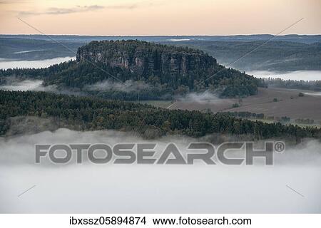 Pfaffenstein with morning fog, Elbe Sandstone Mountains, National Park Saxon Switzerland, Saxony, Germany, Europe View Large Photo Image Picture - Pfaffenstein with morning fog, Elbe Sandstone Mountains, National Park Saxon Switzerland, Saxony, Germany, Europe. Fotosearch