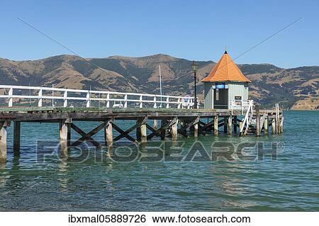 Pier in the bay of Akaroa, Oceania, Banks Peninsula, Canterbury, South Island, New Zealand, Oceania View Large Photo Image Stock Photograph - Pier in the bay of Akaroa, Oceania, Banks Peninsula, Canterbury, South Island, New Zealand, Oceania. Fotosearch