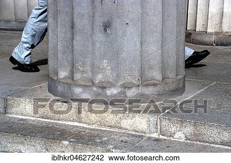Stock Image - Pillar and Legs, Berlin, Germany, Europe. Fotosearch