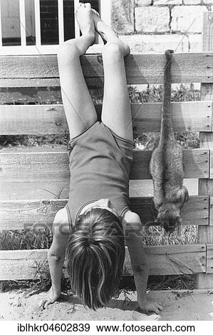 Playing girls and animals, England, Great Britain View Large Photo Image Stock Photo - Playing girls and animals, England, Great Britain. Fotosearch
