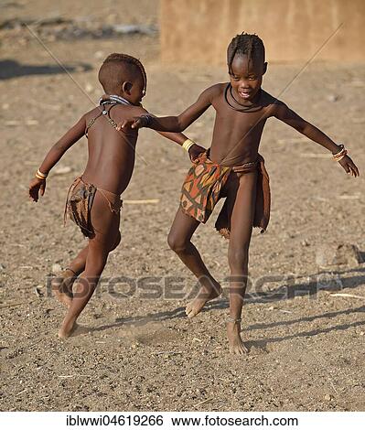 Stock Photograph - Playing Himbamirchen, Kunene, Kaokoveld, Namibia, Africa. Fotosearch