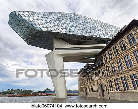 Picture - Port House, futuristic harbour house, modern architecture, architect Zaha Hadid, Het Eilandje, Antwerp, Belgium, Europe. Fotosearch