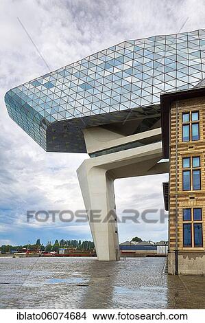 Picture - Port House, futuristic harbour house with a glass façade of triangles, modern architecture, architect Zaha Hadid, Het Eilandje, Antwerp, Belgium, Europe. Fotosearch