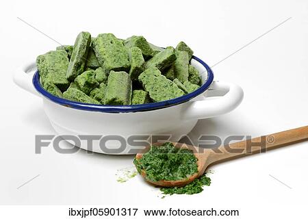 Portioned, frozen creamed spinach in bowl and defrosted spinach in cooking spoon, Germany, Europe View Large Photo Image Stock Photo - Portioned, frozen creamed spinach in bowl and defrosted spinach in cooking spoon, Germany, Europe. Fotosearch