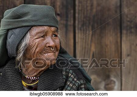Stock Photo - Portrait, Himalaya, elderly woman with headscarf and nose ring, Jiri, Khumbu region, Nepal, Asia. Fotosearch