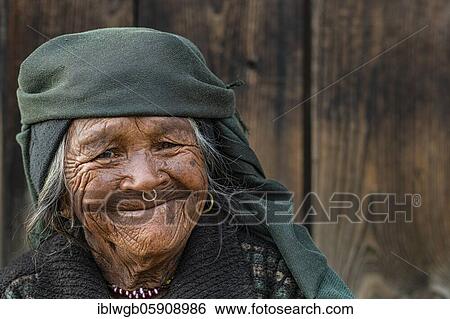 Portrait, Himalaya, friendly smiling elderly woman with headscarf and nose ring, Jiri, Khumbu region, Nepal, Asia View Large Photo Image Stock Photograph - Portrait, Himalaya, friendly smiling elderly woman with headscarf and nose ring, Jiri, Khumbu region, Nepal, Asia. Fotosearch