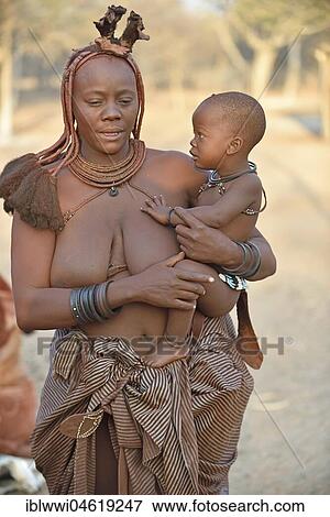Stock Photo - Portrait of a married Himbafrau with toddler, Kaokoveld, Namibia, Africa. Fotosearch