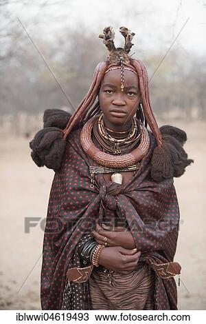 Portrait of a young married woman with blanket, headdress and necklace, Opuwo, Kaokoveld, Namibia, Africa View Large Photo Image Stock Image - Portrait of a young married woman with blanket, headdress and necklace, Opuwo, Kaokoveld, Namibia, Africa. Fotosearch