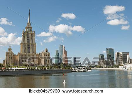 Stock Image - Radisson Hotel, formerly Hotel Ukraina, Seven Sisters, confectionery style, on the Moskva, in the back Moscow City, Moscow, Russia, Europe. Fotosearch