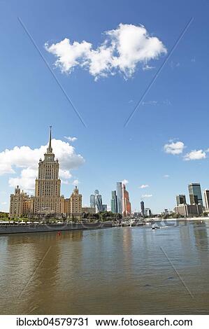 Stock Image - Radisson Hotel, formerly Hotel Ukraina, Seven Sisters, confectionery style, on the Moskva, in the back Moscow City, Moscow, Russia, Europe. Fotosearch