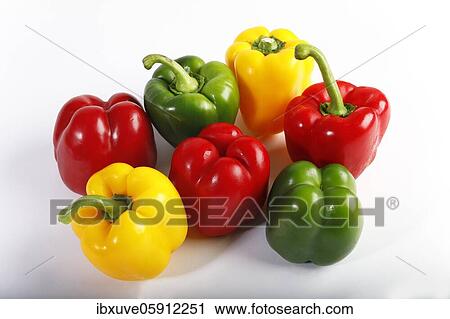 Stock Image - Red, yellow and green peppers (Capsicum annuum), vegetables, studio recording, Germany, Europe. Fotosearch